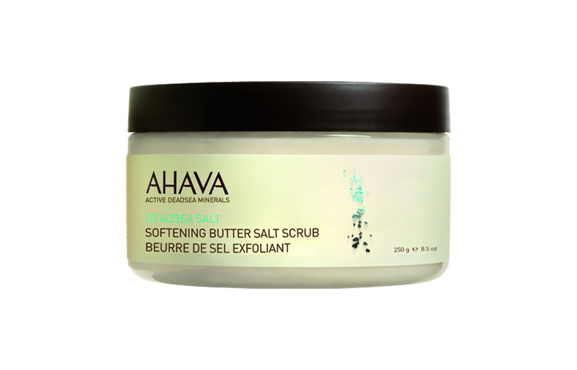 AHAVA Dead Sea Salt Softening Butter Salt Scrub in weißem Behälter mit schwarzem Deckel, 250g.