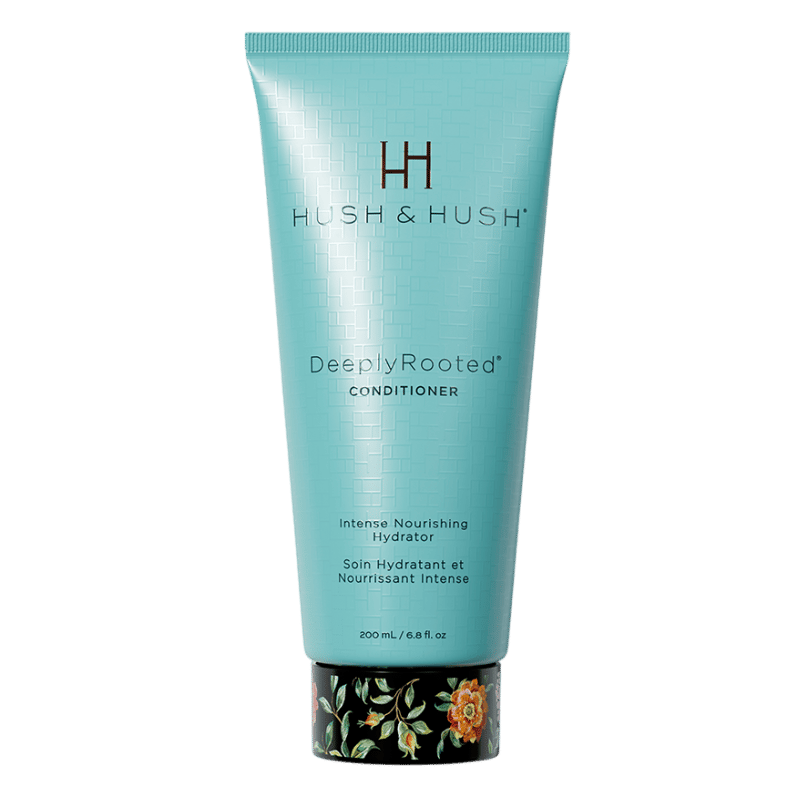 Hush & Hush DeeplyRooted Conditioner, 200 ml, intensiver nährender Hydrator in türkisfarbener Tube mit floralem Design am Boden.